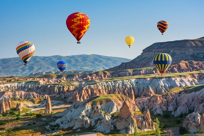 Magiškas Kapadokijos peizažas su oro balionais – unikali patirtis keliautojams ieškantiems įspūdžių. Nuotrauka iš Shutterstock.